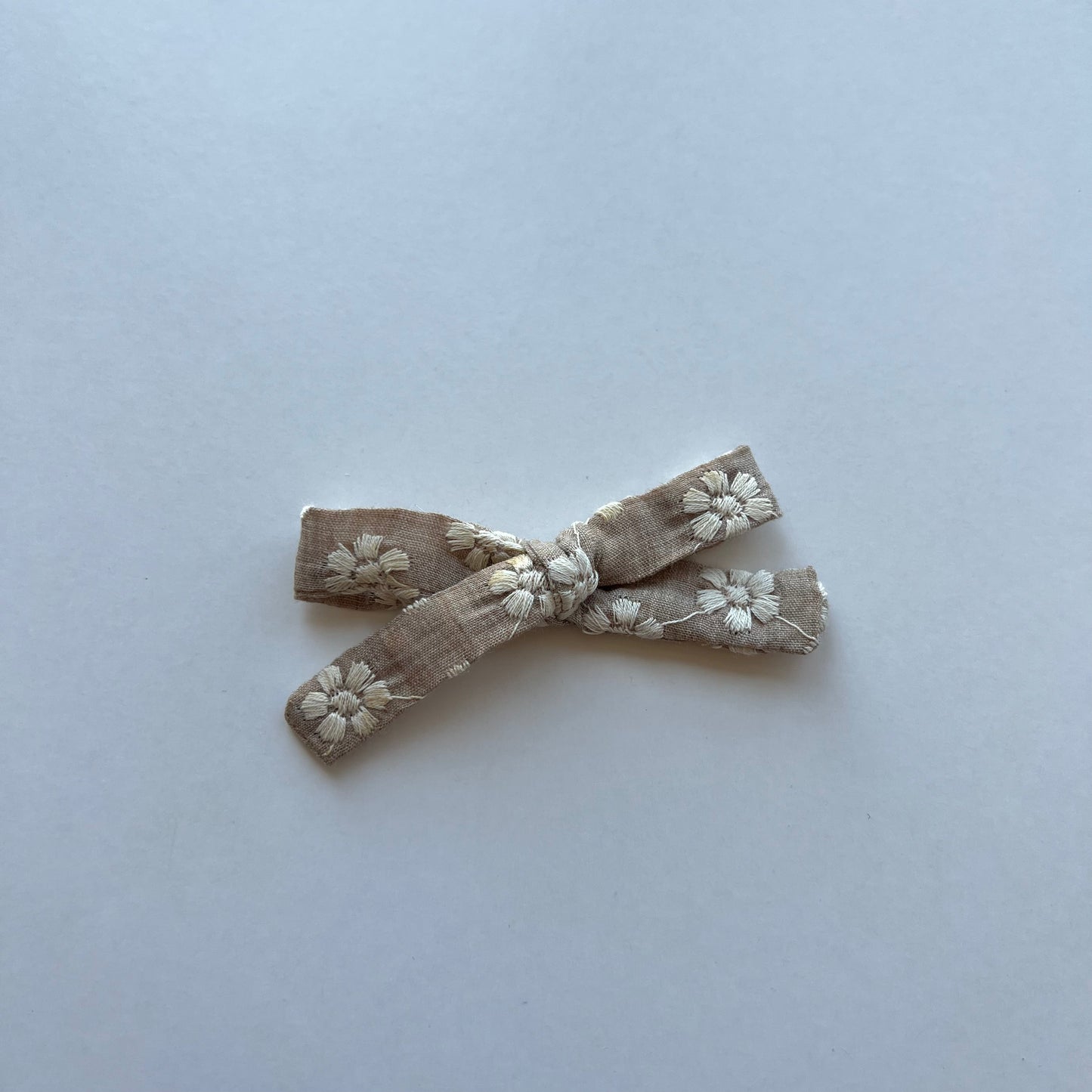 beige embroidered | skinny bow